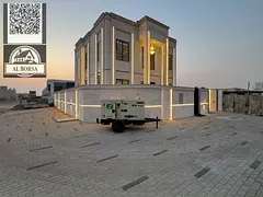 For sale, a villa in Al Helio 2, Ajman, 4 master bedrooms, a living room, a hall, and a corner