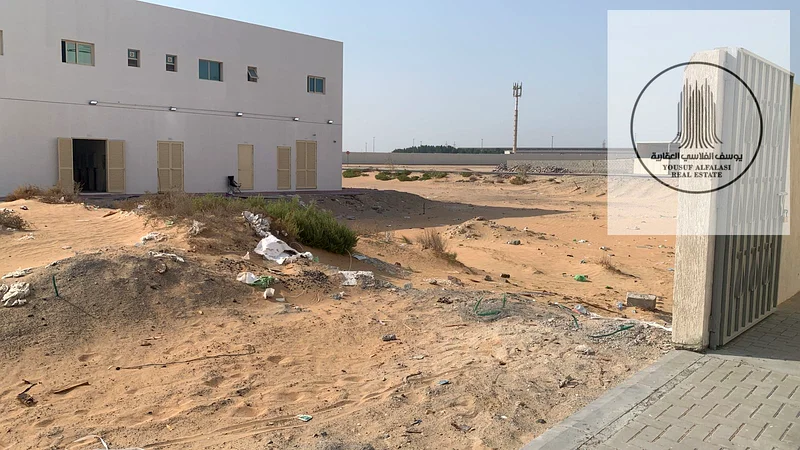 Land for rent in Ajman, Al Jurf Industrial 3, on a main street, area 6400 feet, price 89600 dirhams, suitable for warehouses and long-term contract64074673685121110