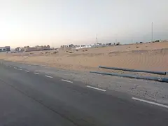 Two residential plots for sale in the Al Hoshi area, Al Badia suburb, Sharjah.