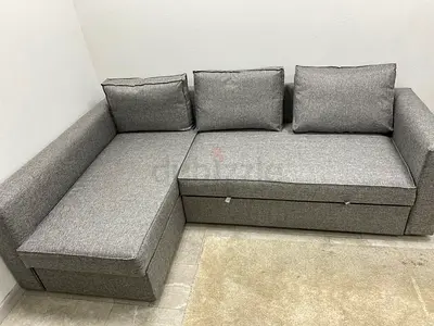 L-shaped sofa com bed with storage