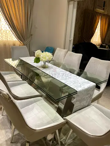 Elegant Glass Dining Table with Stylish Chairs