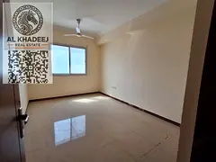 A furnished apartment with a hall for annual rent in Al Rawda area - Ajman, a prime location directl
