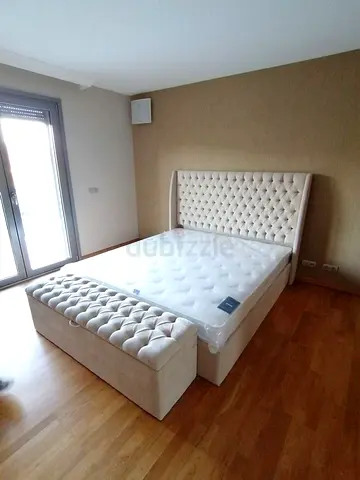 Elegant King Size Bed with Plush Headboard