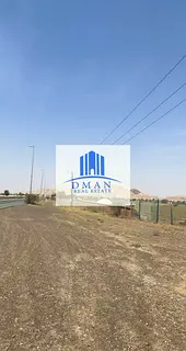 For sale, 4 commercial, residential, and agricultural lands in Al Madam, on a main street