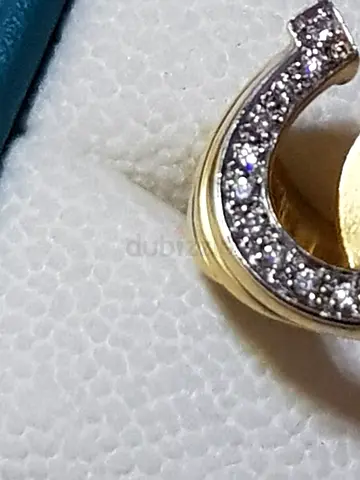 18K GOLD RING WITH 17-PIS DIAMONDS 0.40K,MADE IN THE SHAPE OF A HORSESHOE WEIGHT-9.50 RING SIZE-18,3