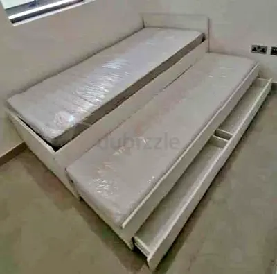 Ikea slakt bed frame with under bed and 2 storage drawers underneath with 2 Ikea mattresses