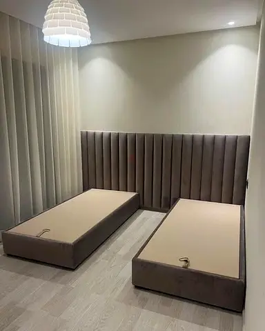 Elegant Twin Beds with Stylish Headboard
