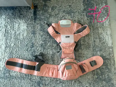Baby carrier with a hip seat pink