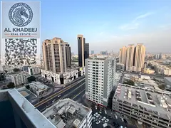 For annual rent in Ajman, two bedrooms, a hall, two bathrooms, and a balcony with an open view of Sh