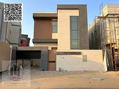 modern villa for sale in Al Yasmeen, consisting of 5 master bedrooms, a living room, a maid's room, 