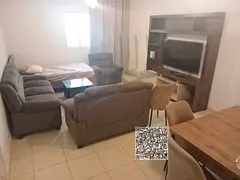 For Sale – Premium Apartment in Orient Towers, Ajman  A luxurious apartment with two bedrooms, a l