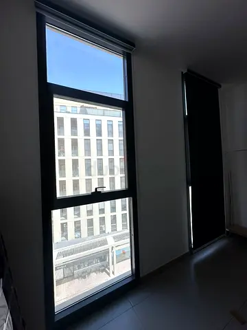 Stylish Black Roll-up Blinds for Modern Windows