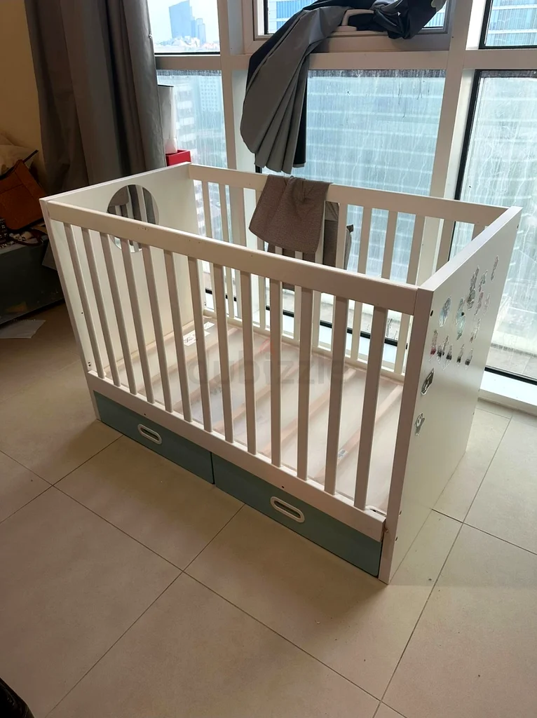 Stylish and Functional Baby Cot with Storage Drawers dubizzle