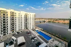 Upper Level Unit with Views of the Pool + Canal