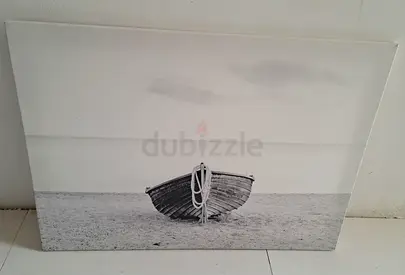 Timeless Serenity: Black and White Boat Canvas Art