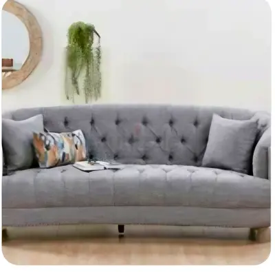 Elegant Grey Curved Sofa with Plush Cushions