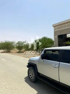 Prime Corner Industrial Land in Arqoub, Sharjah | Strategic Location – Freehold – Fully Serviced