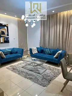 Real estate investment opportunity in Orient Towers, Ajman - 2 bedroom and hall apartment for sale w