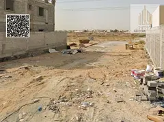 Villa plot in Al-Yasmeen area on an asphalt street