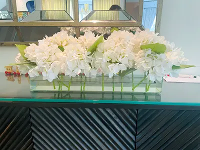 Elegant White Hydrangea Floral Arrangement.  A symbol of gratitude and grace, this dainty hydrangea