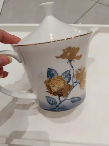 Elegant Porcelain Teapot with Floral Design