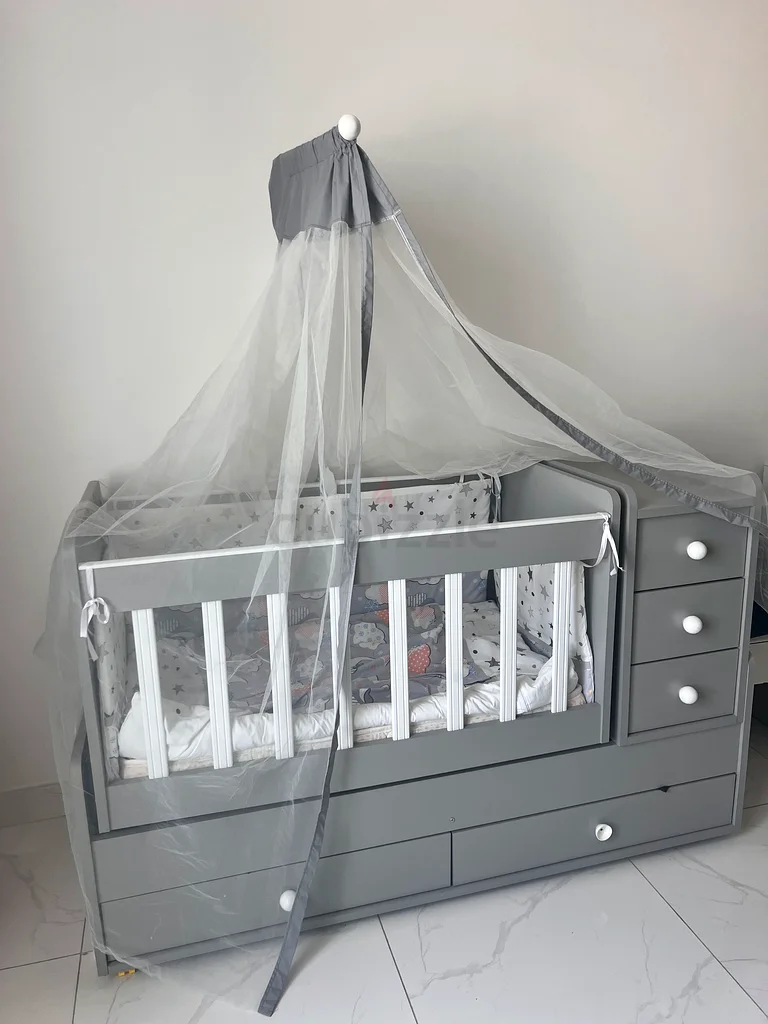 Stylish Grey and White months used crib with ample storage