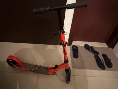 Kids Orange and Black Scooter - Fun Ride for Children!