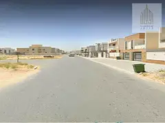 Two plots of land in Al Zahya Square project, including fees