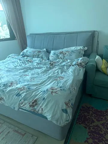 Elegant Grey Bed with Soft Bedding - Perfect for Your Bedroom