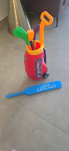 Kids golf set and trolley and plastic cricket bat