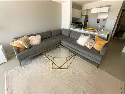 West Elm Andes Stylish Corner-Shaped Grey Sofa with Chic Accessories