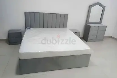 Stylish Gray Upholstered Bed Set with Nightstands and Dresser