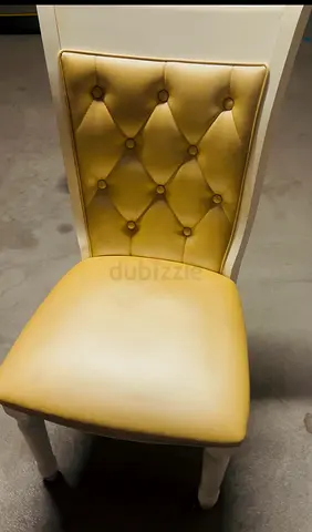 Elegant Beige Dining Chair with Tufted Back