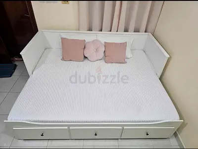 Ikea hemnes daybed frame with underneath storage drawers and mattress.