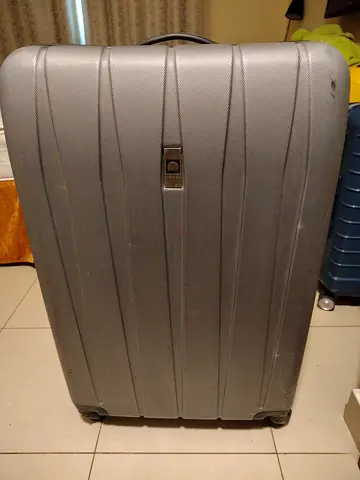 Sturdy and Spacious Grey Suitcase for Your Next Adventure!