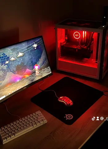 Gaming PC Setup with RGB Lighting and Monitor