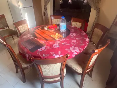 Stylish Round Dining Table with Elegant Chairs