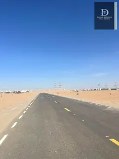 or sale in Sharjah Mizra'a area, Al Rahmaniya suburb Commercial land with an area of ​​7000 