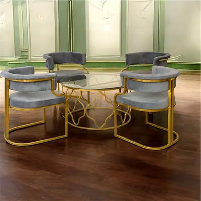 Elegant Grey Velvet Chairs with Gold Base and Glass Table