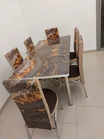 Brand new dining table with 6 chairs available