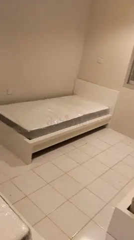 Stylish White Bed with Storage Solution