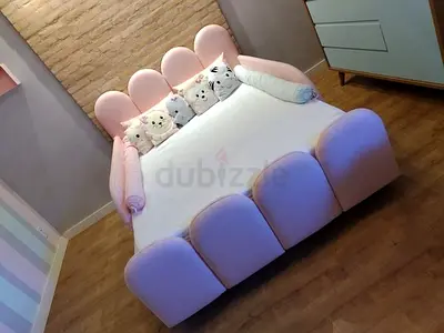 Charming Pink Bed with Cozy Cushions