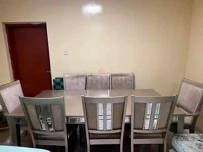 Elegant Dining Table with Plush Chairs