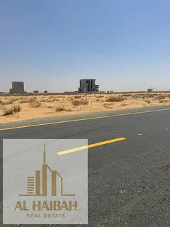 For sale: a residential plot of land in Sharjah, Al Rawda Al Qurt area, on a wide street of 54 meter