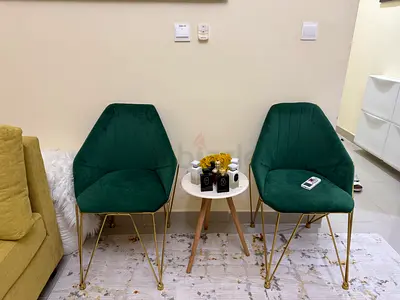 Stylish Green Velvet Chairs with Elegant Gold Legs