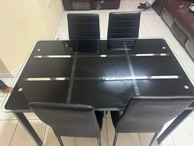 Modern Black Glass Dining Table with Stylish Chairs