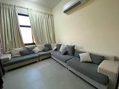 Spacious L-Shaped Sofa with Cushions