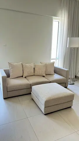 3 seater sofa with 4 cushions and ottoman