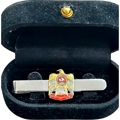 A tie stabiliser made in Britain in 1975 of 18-carat gold bearing the first logo of the Emirates