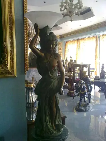 2 bronze floor lamp statues  right  left